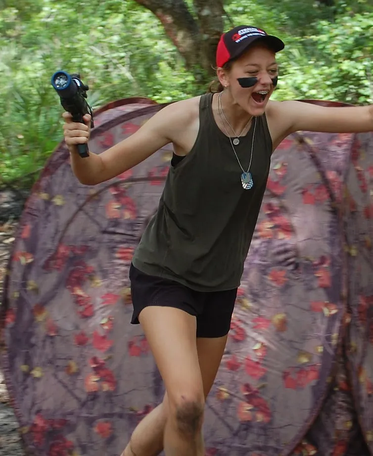 Players moving through a Stealth mobile laser tag field outdoors.
